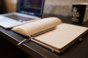 Desk with laptop and journal